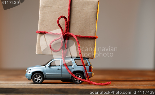 Image of Card with car carrying gift