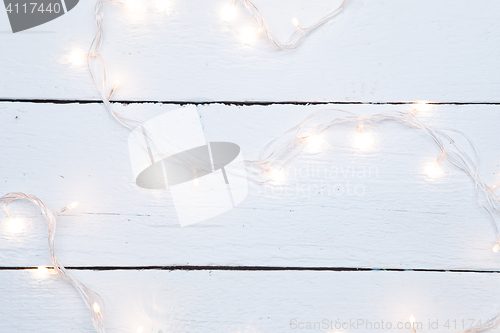 Image of Christmas garland on wooden floor