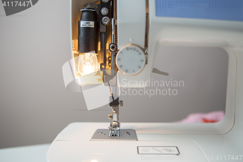 Image of Sewing machine on gray background