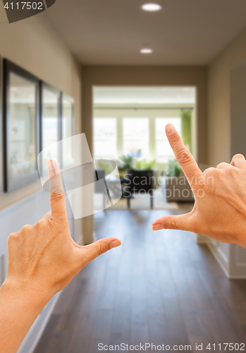 Image of Framing Hands Looking Down Hallway of House