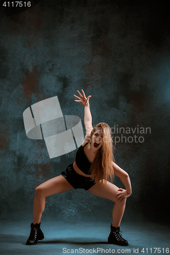 Image of Attractive girl dancing twerk in the studio