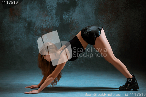 Image of Attractive girl dancing twerk in the studio