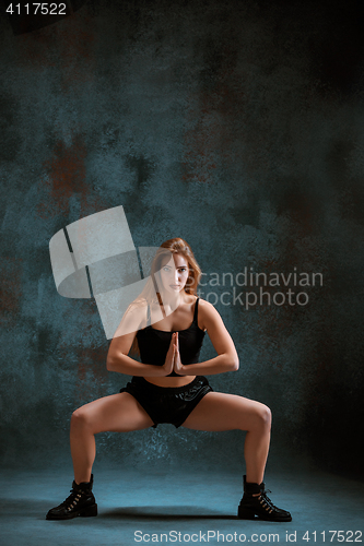 Image of Attractive girl dancing twerk in the studio