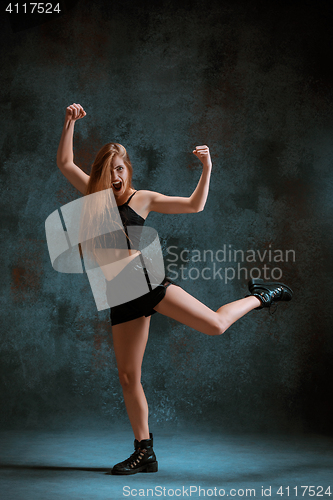 Image of Attractive girl dancing twerk in the studio