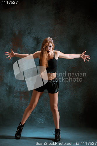 Image of Attractive girl dancing twerk in the studio