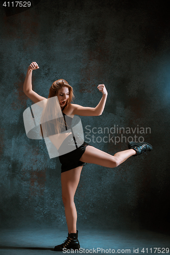 Image of Attractive girl dancing twerk in the studio