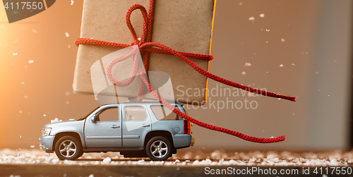 Image of Car carrying gift background snow