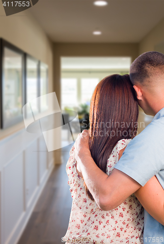 Image of Military Couple Looking Down the Hallway of New House