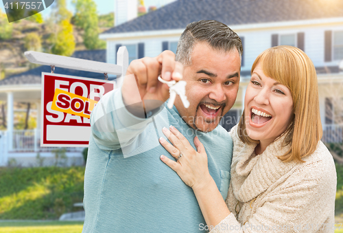 Image of Mixed Race Couple With Keys in Front of Real Estate Sign and New