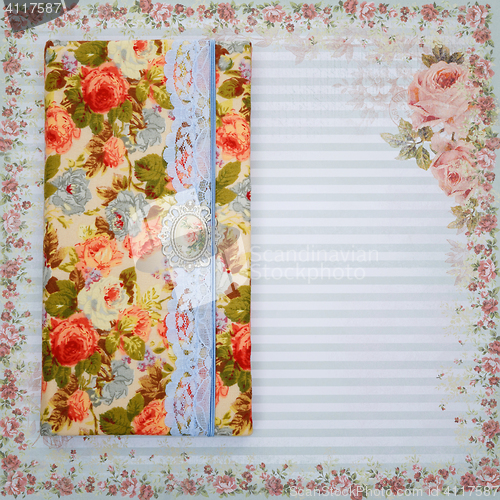 Image of Scrapbooking holder for travel documents on floral paper