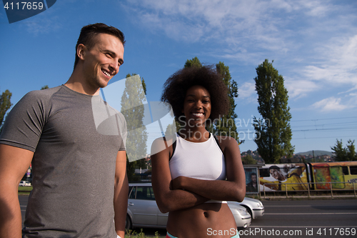 Image of Portrait of romantic pretty couple on fitness session, outside t