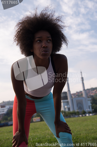 Image of Portrait of sporty young african american woman running outdoors