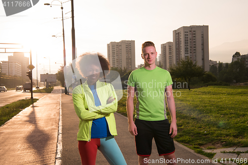 Image of Portrait of romantic pretty couple on fitness session, outside t