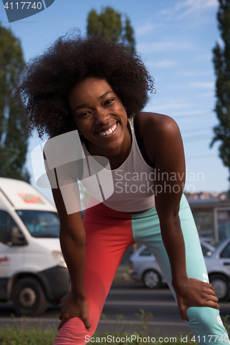 Image of Portrait of sporty young african american woman running outdoors