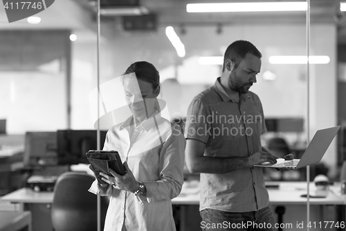 Image of business couple at office