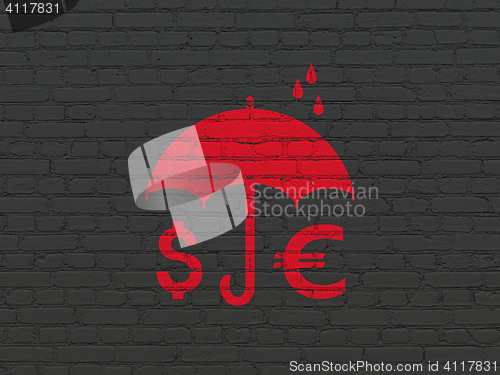 Image of Privacy concept: Money And Umbrella on wall background