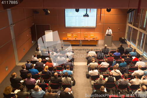 Image of Business speaker giving a talk in conference hall.