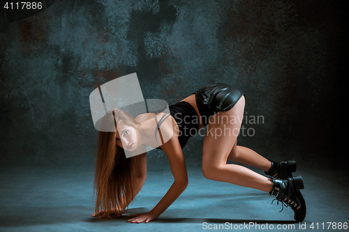 Image of Attractive girl dancing twerk in the studio