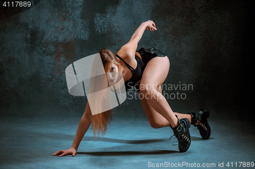 Image of Attractive girl dancing twerk in the studio