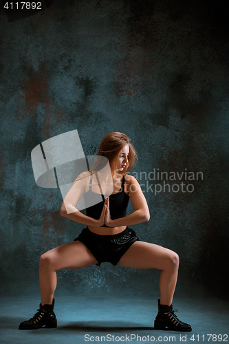 Image of Attractive girl dancing twerk in the studio