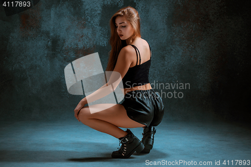 Image of Attractive girl dancing twerk in the studio