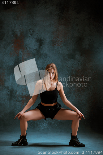 Image of Attractive girl dancing twerk in the studio