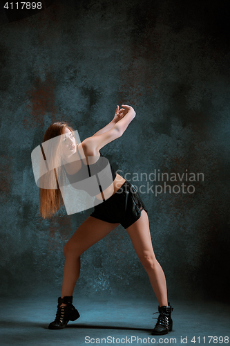 Image of Attractive girl dancing twerk in the studio