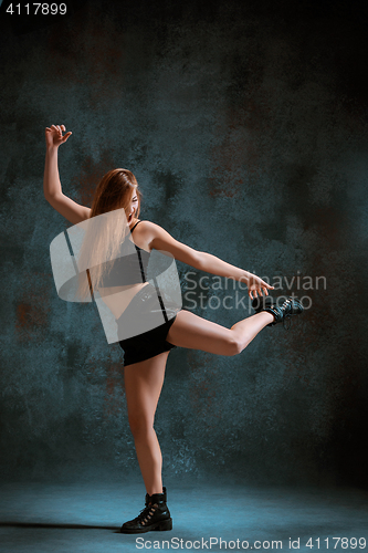 Image of Attractive girl dancing twerk in the studio