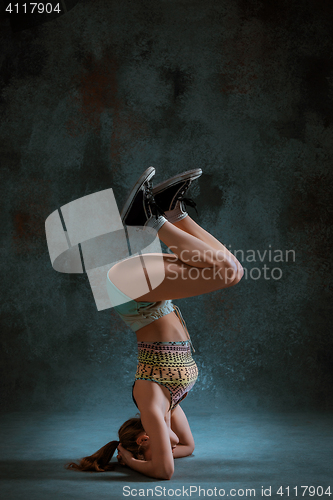 Image of Attractive girl dancing twerk in the studio