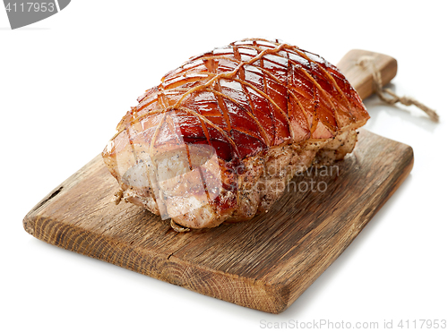 Image of roasted pork on wooden cutting board