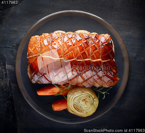 Image of roasted pork on dark plate