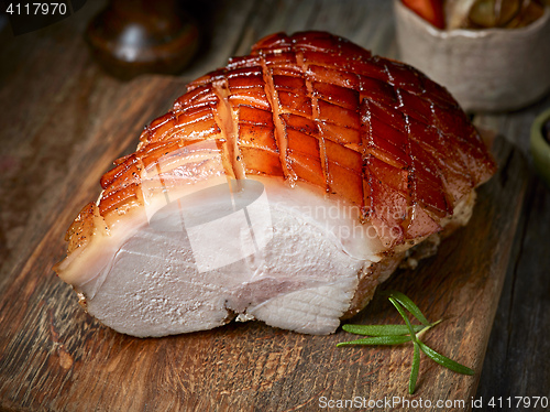 Image of roasted pork on wooden table