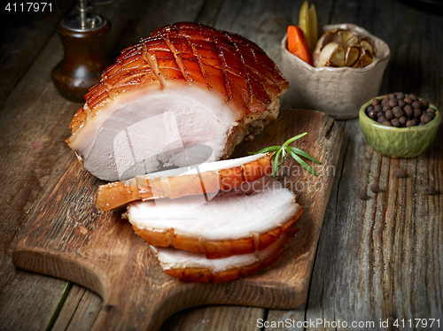 Image of roasted pork on wooden table