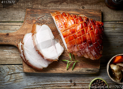 Image of roasted pork on wooden cutting board