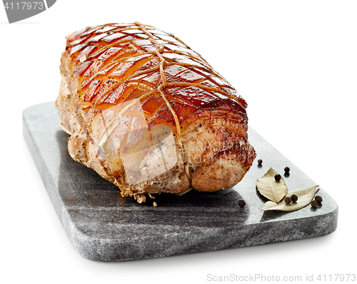 Image of roasted pork on gray cutting board