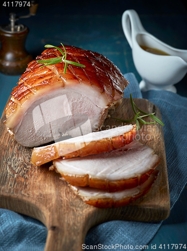 Image of roasted pork on wooden cutting board