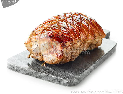 Image of roasted pork on gray cutting board