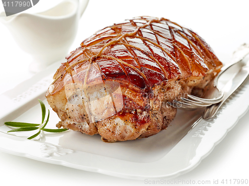 Image of roasted pork on white plate