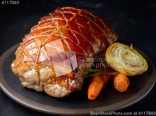 Image of roasted pork on dark plate