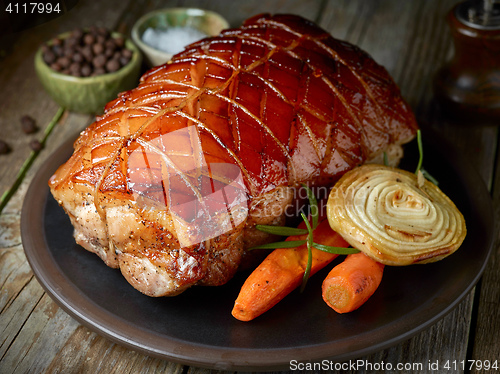 Image of roasted pork on dark plate