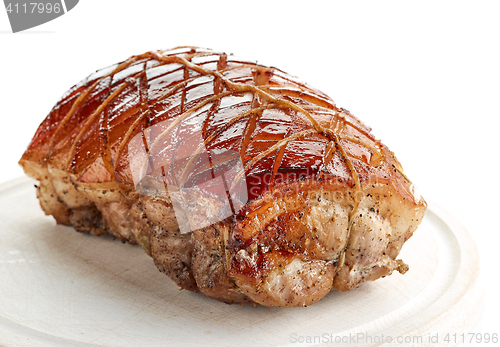 Image of roasted pork on wooden cutting board