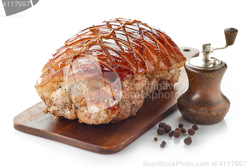 Image of roasted pork on wooden cutting board