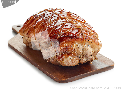 Image of roasted pork on wooden cutting board