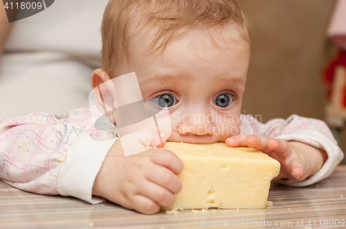 Image of Baby liked a piece of tasty cheese