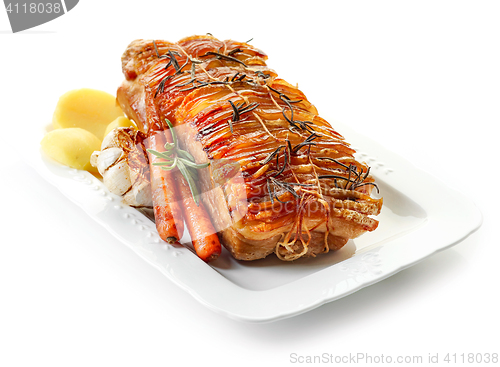 Image of roasted pork and vegetables on white plate