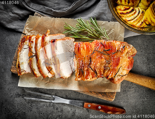 Image of roasted pork on dark gray table