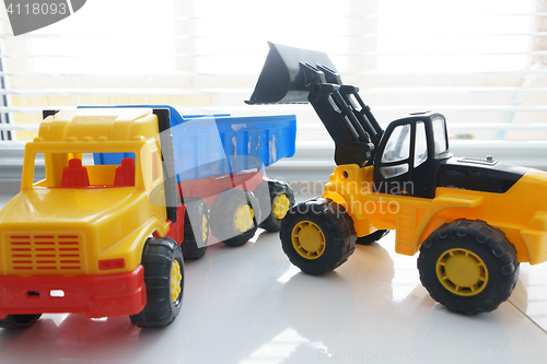 Image of Toy Wheel Loader and Toy Dump Truck