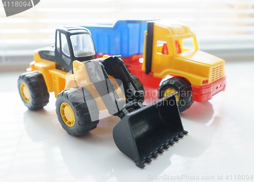 Image of Toy Wheel Loader and Toy Dump Truck