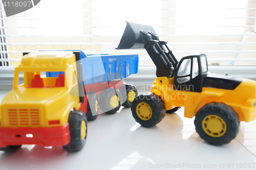 Image of Toy Wheel Loader and Toy Dump Truck