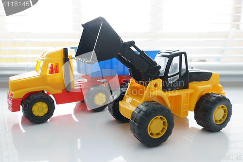 Image of Toy Wheel Loader and Toy Dump Truck